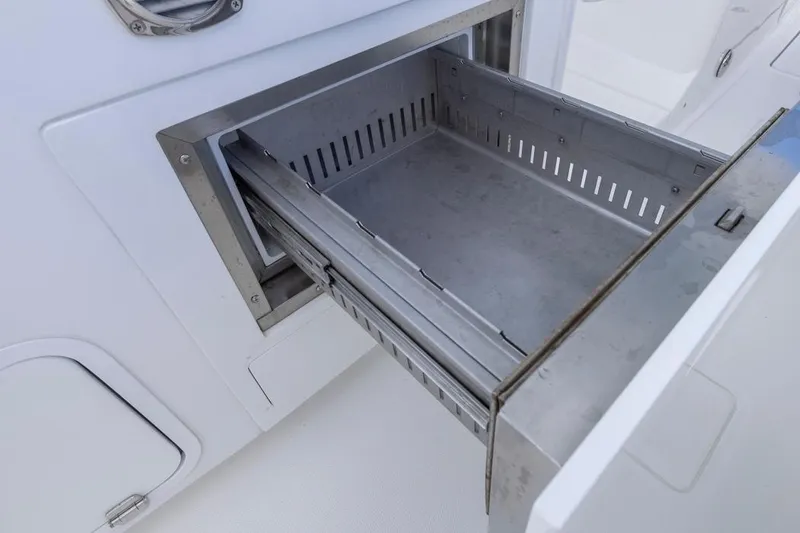 Slide: The Image of Open storage compartment on 2023 HCB 39 Speciale boat, showcasing sleek design. - 44