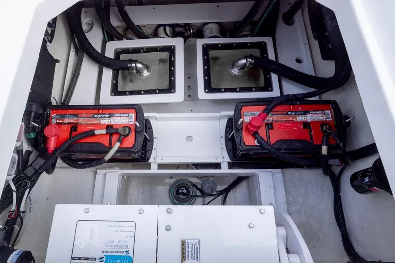 Slide: The Image of 2023 HCB 39 Speciale boat engine compartment with batteries and wiring. - 50