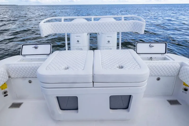 Slide: The Image of 2023 HCB 39 Speciale boat interior with white quilted seating and ocean backdrop. - 55