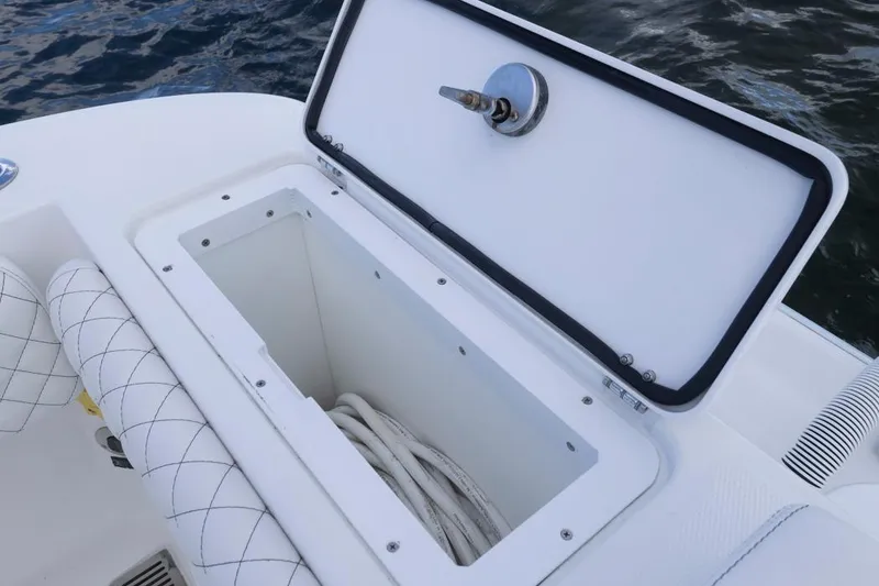 Slide: The Image of Open storage compartment on 2023 HCB 39 Speciale boat, featuring white interior and quilted seating. - 56