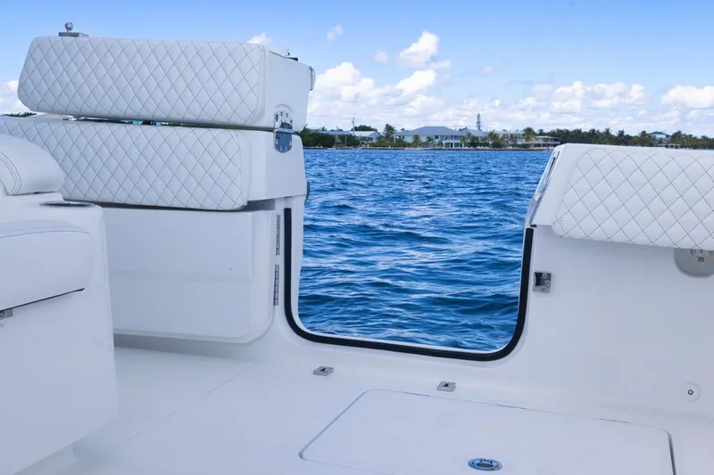 Slide: The Image of 2023 HCB 39 Speciale boat interior with open door, overlooking blue ocean and sky. - 59