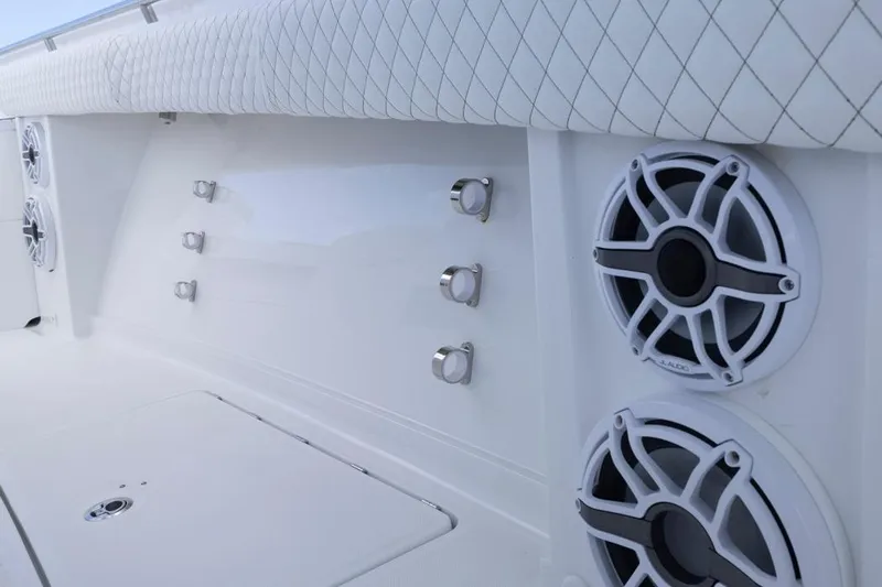 Slide: The Image of 2023 HCB 39 Speciale boat interior with speakers and quilted upholstery. - 61