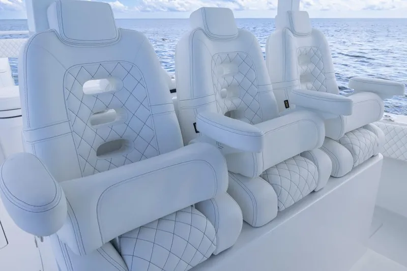 Slide: The Image of Luxurious white seating on 2023 HCB 39 Speciale boat, ocean backdrop. - 62