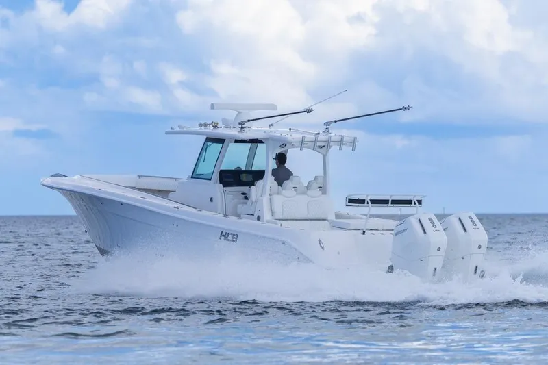 Slide: The Image of 2023 HCB 39 Speciale boat cruising on open water under a cloudy sky. - 69