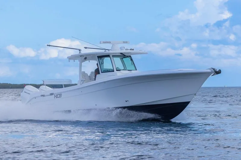 Slide: The Image of 2023 HCB 39 Speciale boat cruising on open water under a clear blue sky. - 71