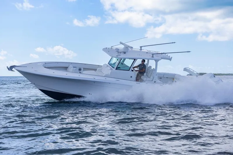 Slide: The Image of 2023 HCB 39 Speciale boat cruising on open water under a clear sky. - 78