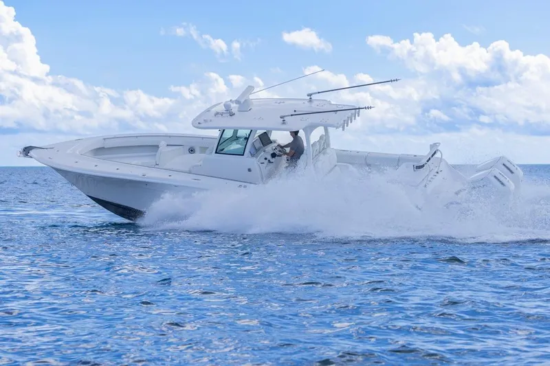 Slide: The Image of 2023 HCB 39 Speciale boat cruising on open water with splashing waves. - 79