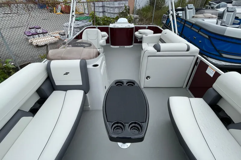Slide: The Image of 2026 Starcraft EX 20 FD pontoon boat interior with plush seating and modern helm. - 13