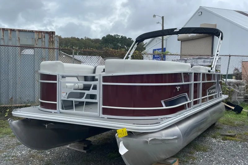 Slide: The Image of 2026 Starcraft EX 20 FD pontoon boat interior with seating and table. - 14