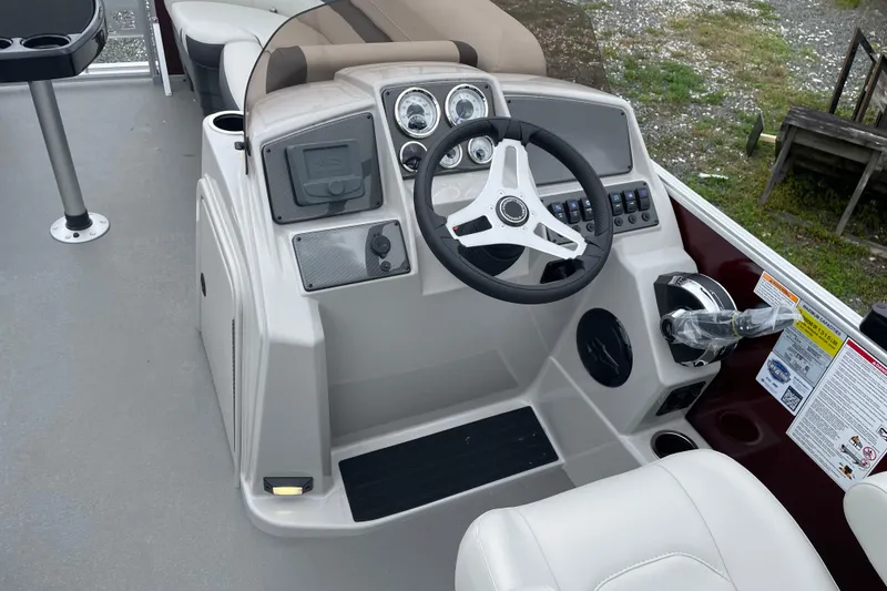 Slide: The Image of 2026 Starcraft EX 20 FD boat interior with steering console and seating. - 3