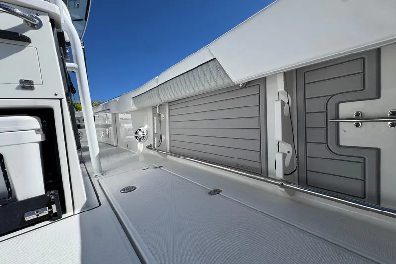 Slide: The Image of 2021 Blackfin 332 CC boat interior with sleek design and modern features. - 13