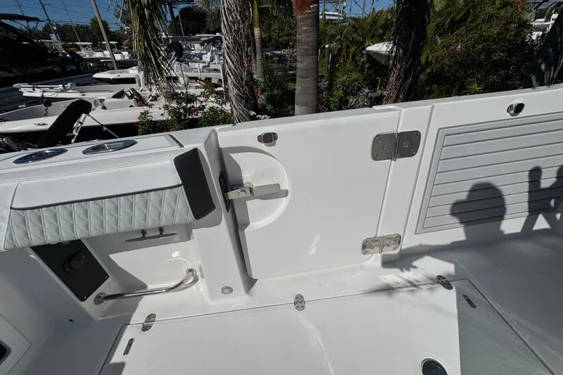 Slide: The Image of 2021 Blackfin 332 CC boat interior with seating and storage compartments. - 16