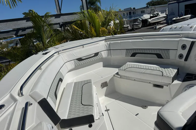 Slide: The Image of 2021 Blackfin 332 CC boat interior with white seating and modern design. - 24