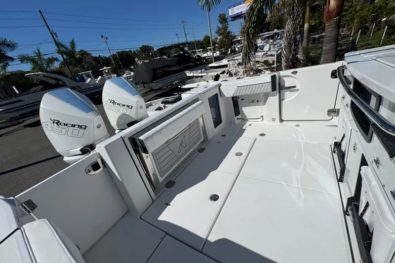 Slide: The Image of 2021 Blackfin 332 CC boat with twin Racing 450 engines, spacious deck, and modern design. - 37