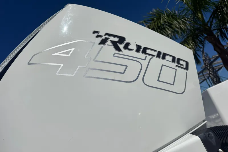 Slide: The Image of Close-up of 'Racing 450' engine on 2021 Blackfin 332 CC boat, under clear blue sky. - 6