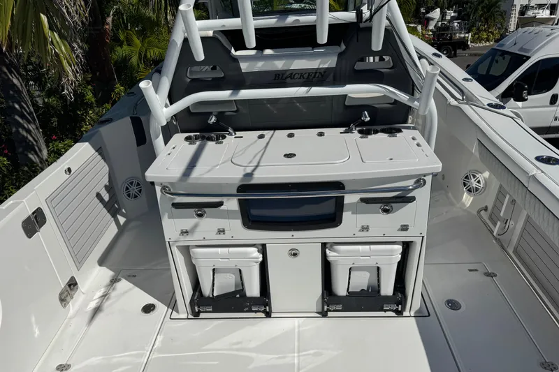 Slide: The Image of 2021 Blackfin 332 CC boat interior with fishing station and storage compartments. - 9