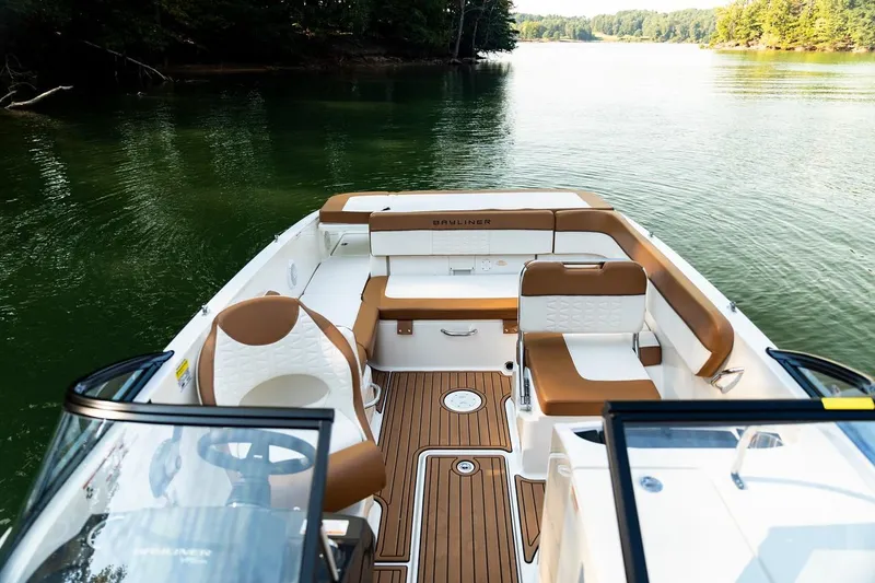 Slide: The Image of 2026 Bayliner VR6 Bowrider OB on serene lake, featuring spacious seating and elegant design. - 13