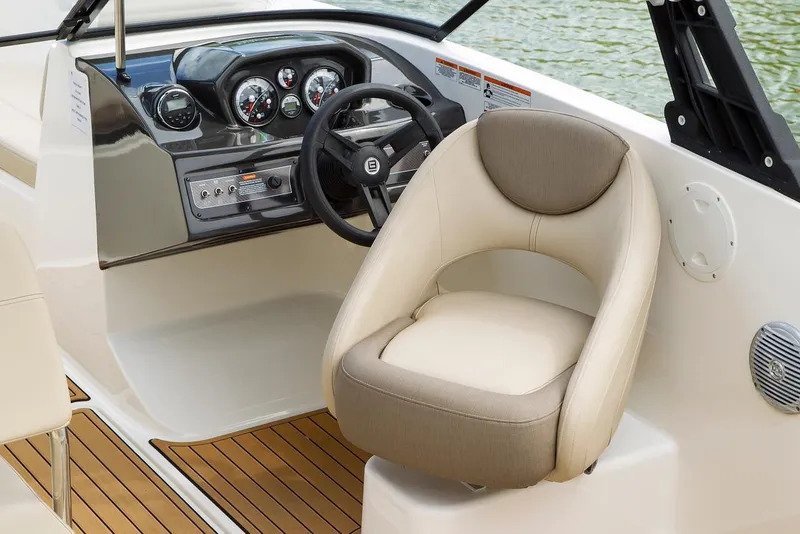 Slide: The Image of 2026 Bayliner VR6 Bowrider OB cockpit with modern steering and comfortable seating. - 7