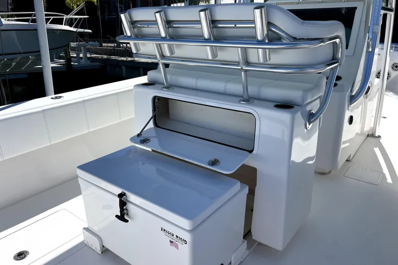 Slide: The Image of 2024 Contender 32 ST boat interior with seating and storage compartments. - 11