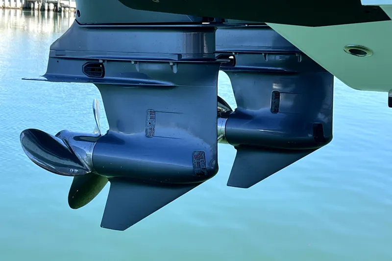 Slide: The Image of 2024 Contender 32 ST boat propellers in clear blue water. - 17