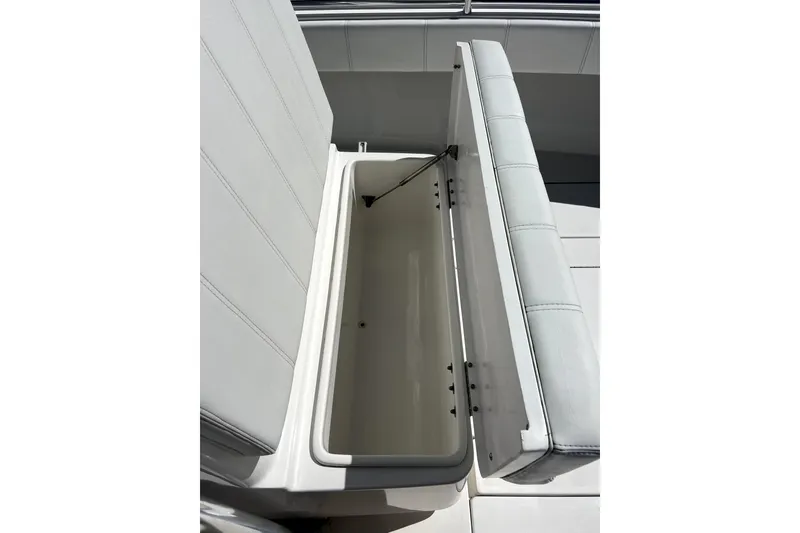 Slide: The Image of 2024 Contender 32 ST boat seat with open storage compartment. - 21