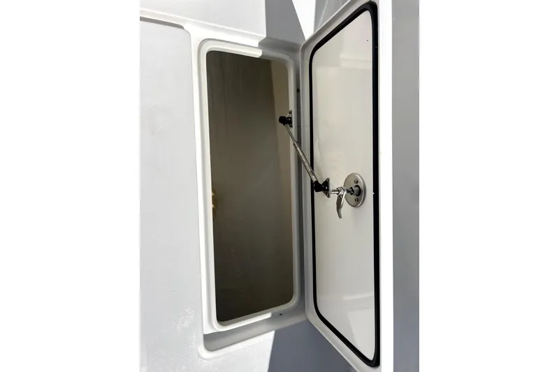 Slide: The Image of Open storage compartment on 2024 Contender 32 ST boat, showcasing interior space. - 22