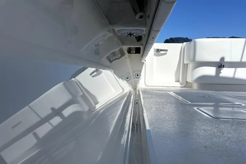 Slide: The Image of 2024 Contender 32 ST boat interior with sleek white design and spacious deck. - 24