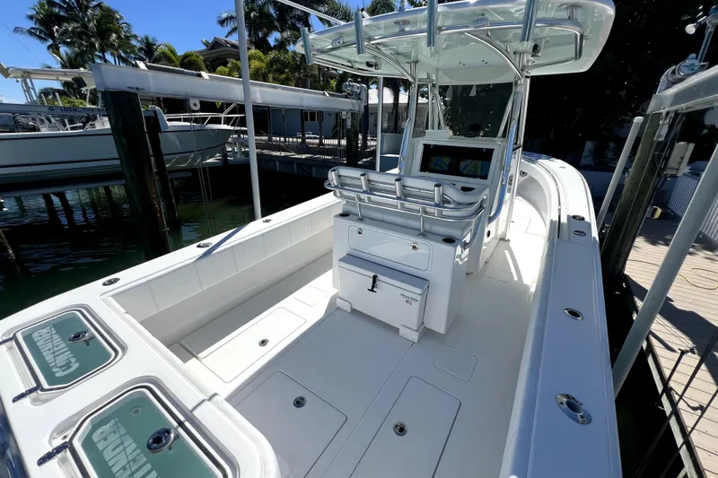 Slide: The Image of 2024 Contender 32 ST boat with sleek design, spacious deck, and modern console. - 3