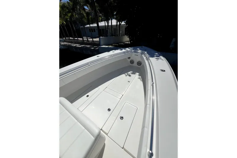 Slide: The Image of 2024 Contender 32 ST boat deck with sleek white finish and spacious seating. - 4