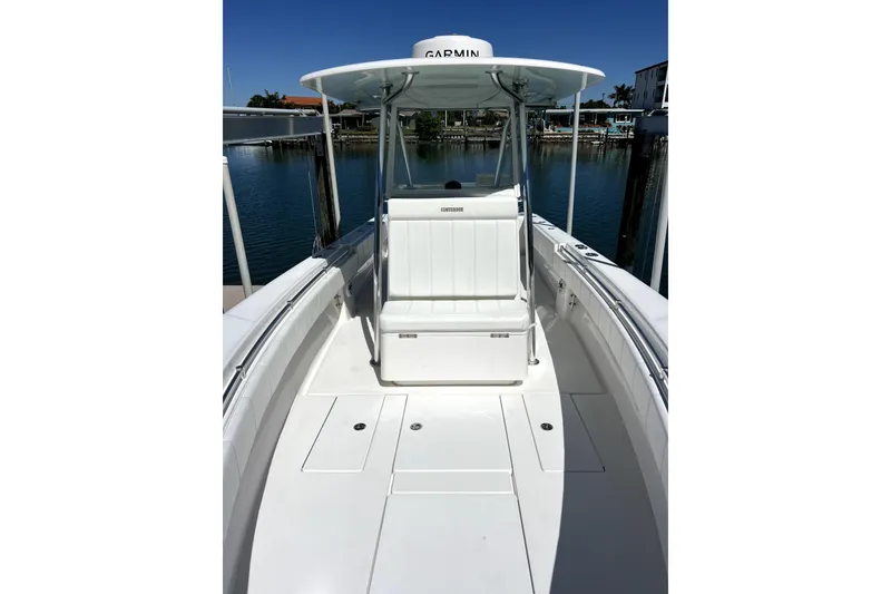 Slide: The Image of 2024 Contender 32 ST boat with Garmin equipment, docked in a marina. - 6