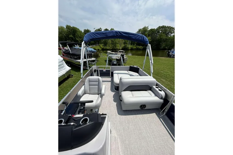 Slide: The Image of 2023 Landau Island Breeze 232 Cruise pontoon boat with spacious seating and canopy. - 10