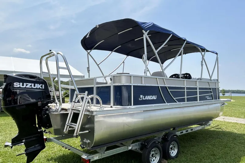 Slide: The Image of 2023 Landau Island Breeze 232 Cruise pontoon boat with Suzuki engine on trailer. - 13