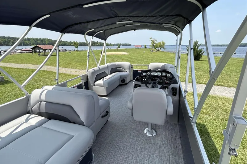 Slide: The Image of 2023 Landau Island Breeze 232 Cruise pontoon boat interior with lake view. - 4