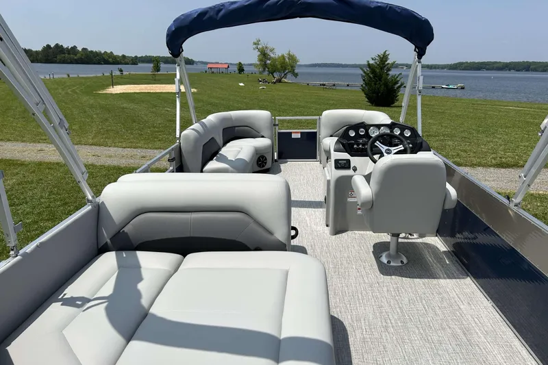 Slide: The Image of 2023 Landau Island Breeze 232 Cruise pontoon boat interior with lake view. - 8