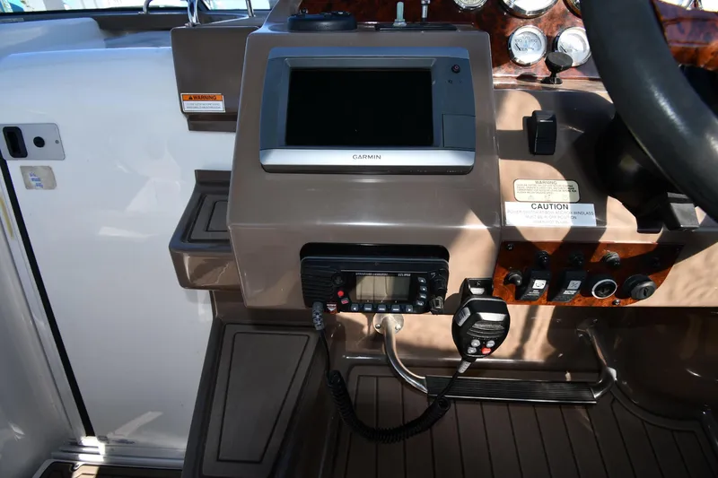 Slide: The Image of Control panel of a 2005 Regal 3060 Window Express boat with navigation equipment. - 11