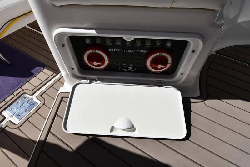 Slide: The Image of 2005 Regal 3060 Window Express DC distribution center with open panel on boat deck. - 20