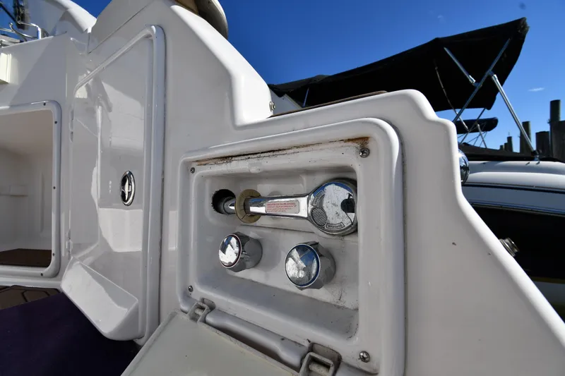 Slide: The Image of 2005 Regal 3060 Window Express boat control panel with chrome fittings. - 22