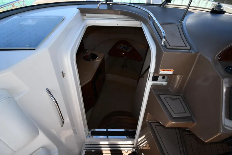 Slide: The Image of 2005 Regal 3060 Window Express cabin entrance with interior view. - 25