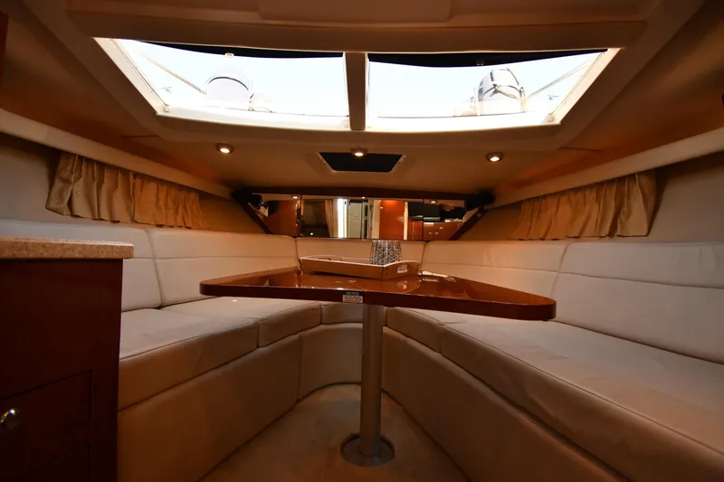 Slide: The Image of Interior of 2005 Regal 3060 Window Express yacht with cozy seating and skylight. - 26