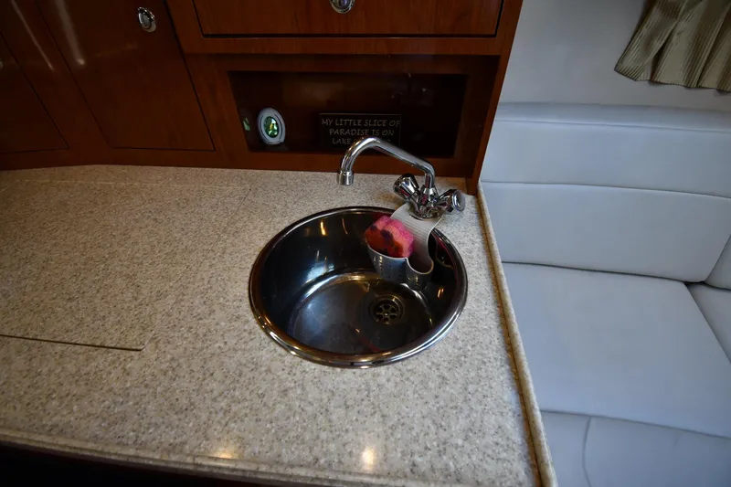 Slide: The Image of 2005 Regal 3060 Window Express boat interior with sink and countertop. - 32