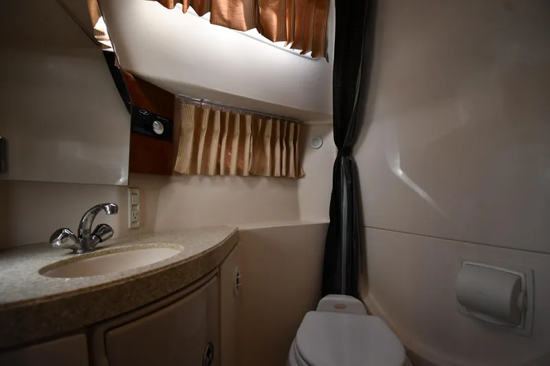 Slide: The Image of 2005 Regal 3060 Window Express bathroom with sink, toilet, and curtain. - 37