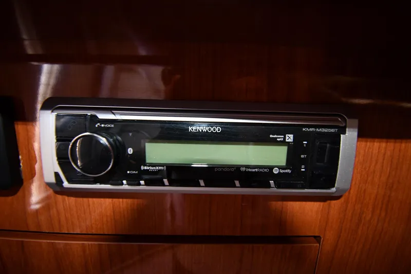 Slide: The Image of Kenwood stereo system in 2005 Regal 3060 Window Express boat interior. - 43