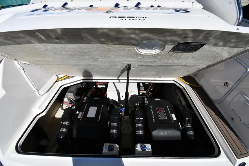 Slide: The Image of Engine compartment of a 2005 Regal 3060 Window Express boat, featuring Volvo Penta engines. - 45