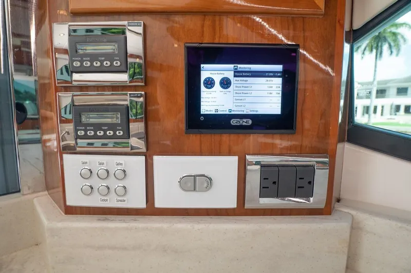 Slide: The Image of Control panel of 2018 Riviera 43 Open Flybridge with digital display and switches. - 10