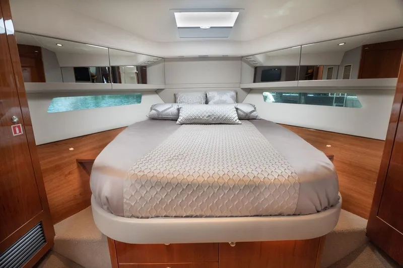 Slide: The Image of Luxurious bedroom interior of 2018 Riviera 43 Open Flybridge yacht with elegant bedding. - 14