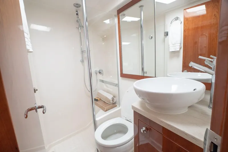 Slide: The Image of Luxurious bathroom in 2018 Riviera 43 Open Flybridge yacht with modern fixtures. - 15