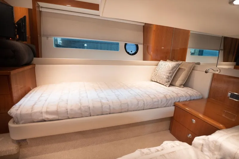 Slide: The Image of Luxurious cabin interior of 2018 Riviera 43 Open Flybridge yacht with cozy bedding. - 16