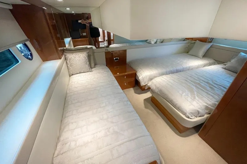 Slide: The Image of Luxurious interior of 2018 Riviera 43 Open Flybridge with twin beds and elegant decor. - 17