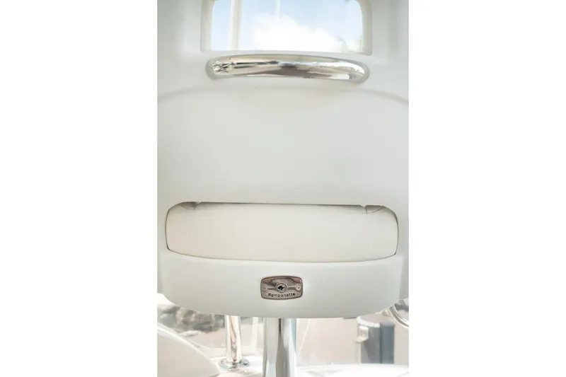 Slide: The Image of 2018 Riviera 43 Open Flybridge interior detail with chrome accents and Pompanette branding. - 6