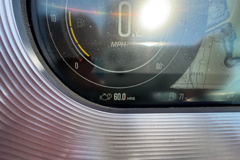 Slide: The Image of Close-up of 2021 MasterCraft XT22 dashboard showing 60 hours and speedometer. - 15